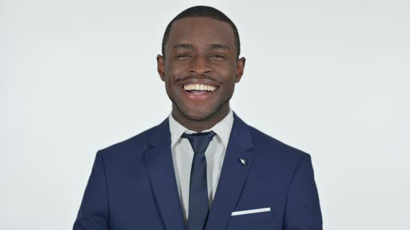 Cheerful African Businessman Smiling, White Background alt