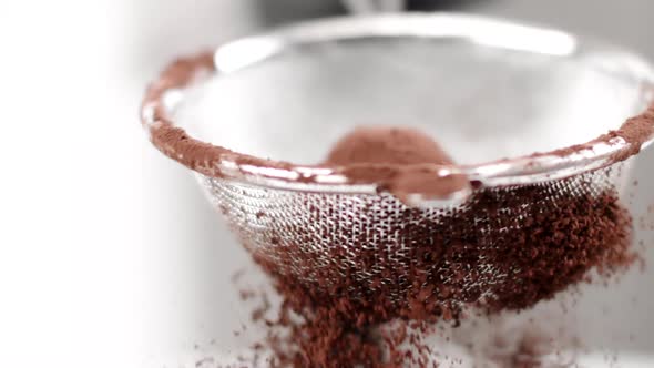 Chocolate Ball Truffle Candy Rolls in Cocoa Powder in Strainer Slow Mo Close Up