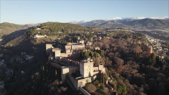 The Alhambra Fortress on Forested Hilltop, Pullback revealing majestic landscape. Spain