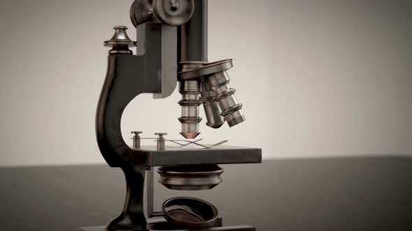 A vintage microscope used to study and analyze microbes, bacteria and cells. alt