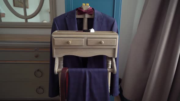 Blue Men's Suit on a Hanger alt