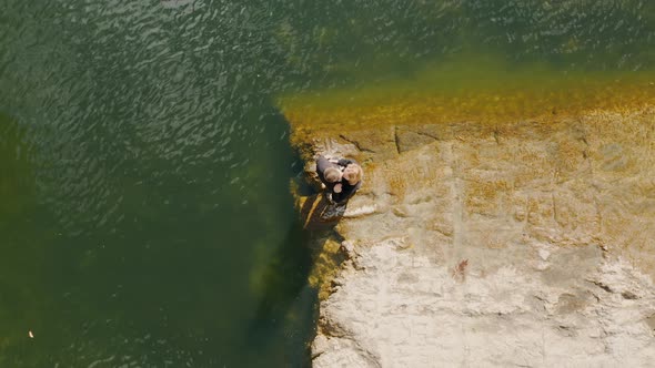 Top view on the loving couple on a beautiful lake Bazhov places Crystal lake alt