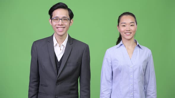 Young Happy Asian Business Couple Together