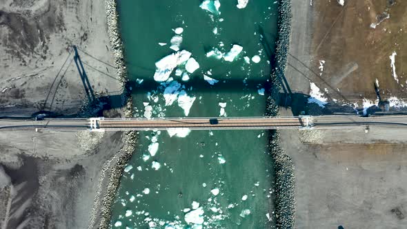 Aerial View of the Bridge, Glacial Lagoon and Icebergs. Iceland in Early Spring