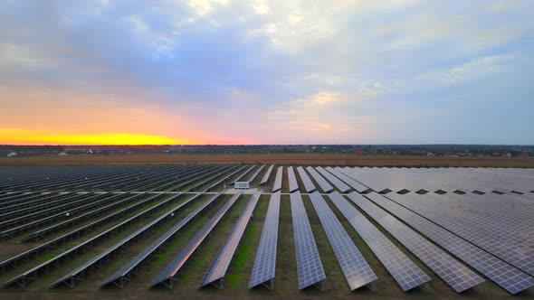 Solar cell power plants at  solar farm at summer sunset, large solar panels, HDR video alt