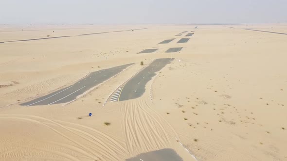 Deserted Road Covered with Sand