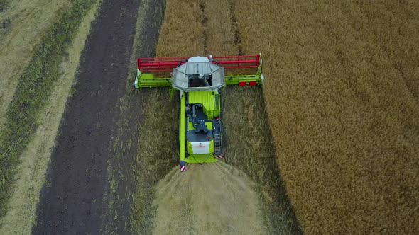 Combine Harvester Working on a Field alt