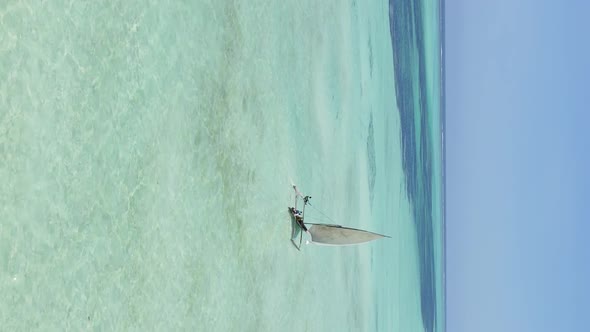 Tanzania Vertical Video  Boat Boats in the Ocean Near the Coast of Zanzibar Aerial View alt