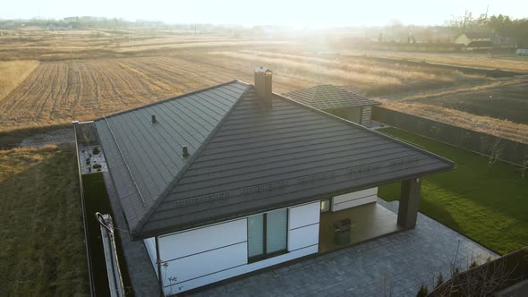 Aerial View of Private House with Ceramic Shingles Covered Roof Top alt