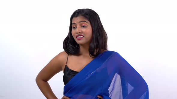 Annoyed Indian woman thinking in saree alt