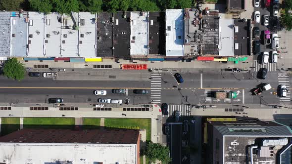 A top down shot over Fulton Street in Bedford Stuyvesant, Brooklyn. The camera is looking straight d alt