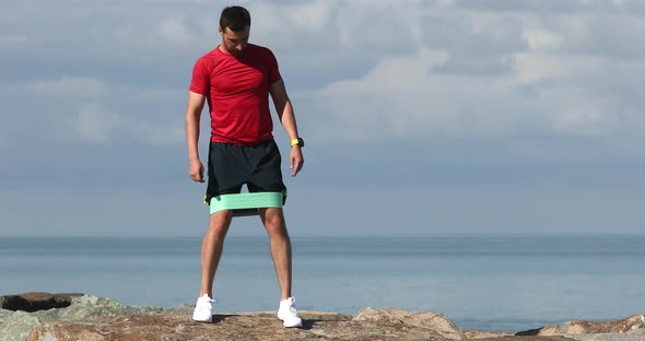 Young strong sporty athletic fit sportsman man in sports clothes warm up training.