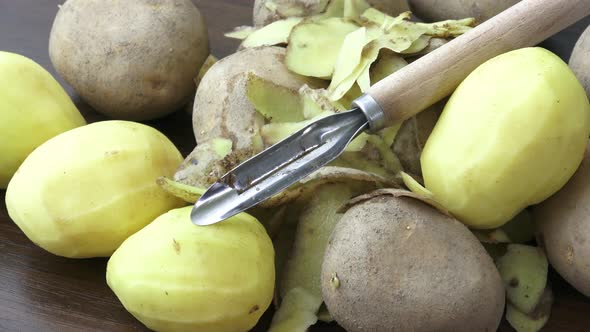 Raw potatoes and knife 