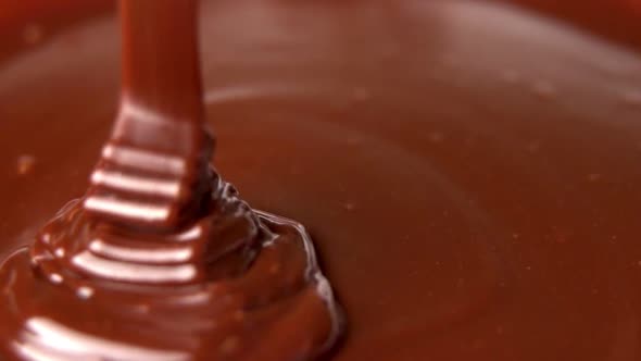Pouring Hot Dark Chocolate. Pouring Melted Liquid Premium Dark Chocolate alt
