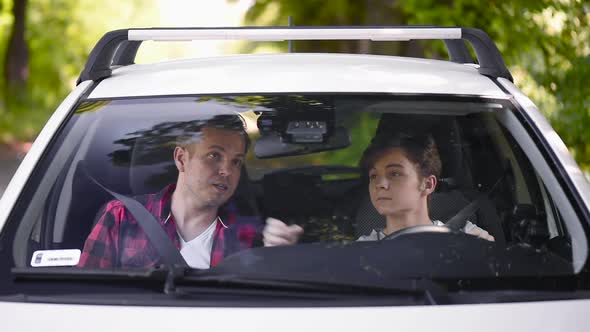 Father and Son in Car alt