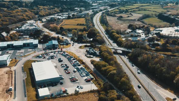 Cars are moving on the highway Parking with many different vehicles