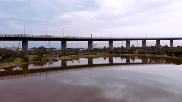 The vibrant wetland and nature sanctuary pink lake drone shot at Westgate Bridge located on the edge alt