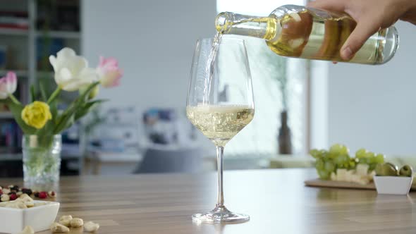 Filling Glass With White Wine