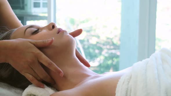 Woman Gets Facial and Head Massage in Luxury Spa alt