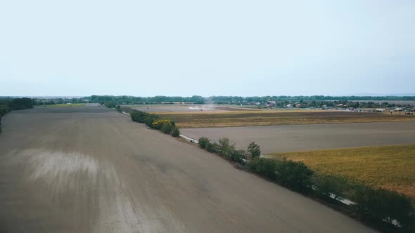 Drone shot of a field during harvest alt