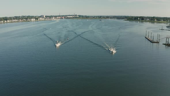 Aerial Drone Shot of Several Boats and a Rower in a Quiet Harbor (Norwalk, Connecticut)