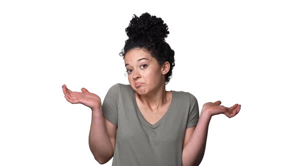 Portrait of Innocent Woman Throwing Up Hands in Rejection Meaning Don't Know or Not My Fault alt