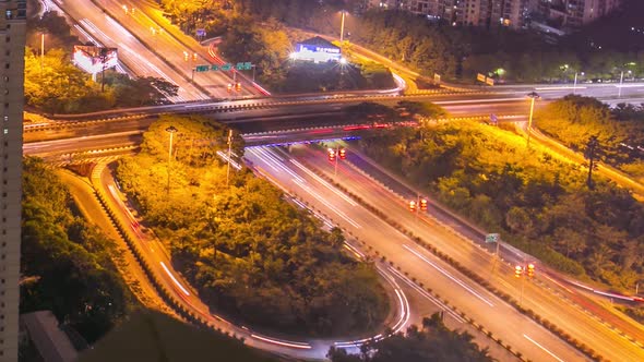 Traffic on highway in large Chinese city downtown at night