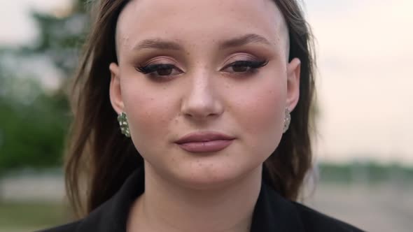 Slow Motion Portrait of a Young Attractive Woman with Makeup
