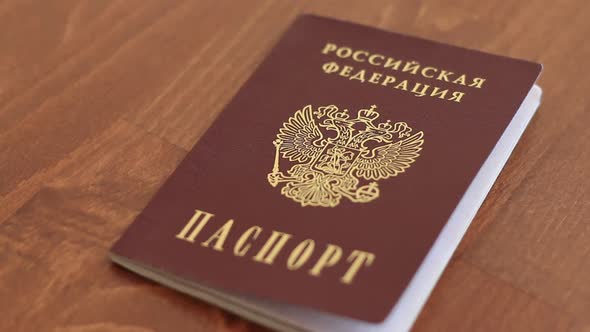 Hands Opening Passport Of Russian Federation