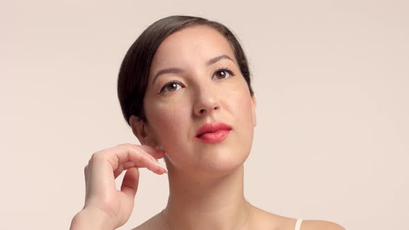 Beauty Brunette Model in Studio Alone with Ideal Shiny Skin Portrait