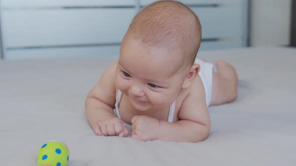 Beautiful Smiling Baby: Smiling Toy and Spits Up Food. alt
