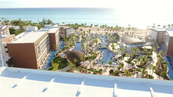 AERIAL Revealing Luxury Hotel Outdoor Amenities And Swimming Pools alt