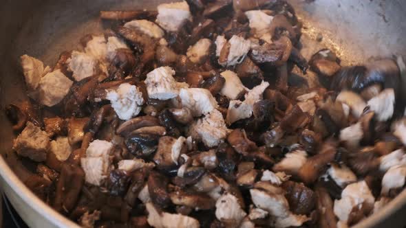 Mushrooms are Fried in a Pan in the Home Kitchen Cooking Mushrooms Julienne alt