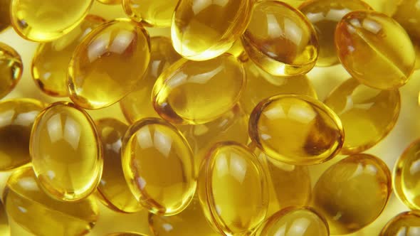 Top Down View Omega 3 Gold Fish Oil Capsules Rotation Background Macro