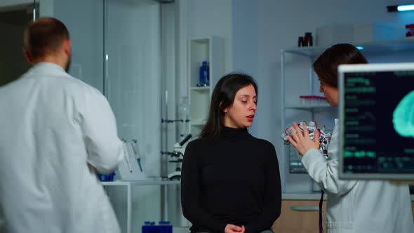 Asistance of Neurological Doctor Putting Eeg Headset on Patient Head alt