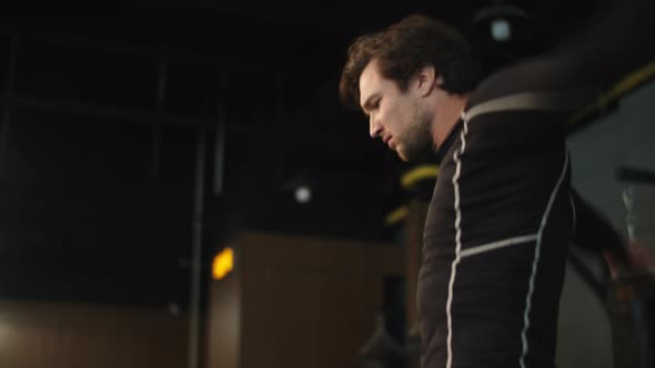 Serious Sport Man Imitating Rope Jumping in Sport Club. Boxer Warming Up at Gym alt