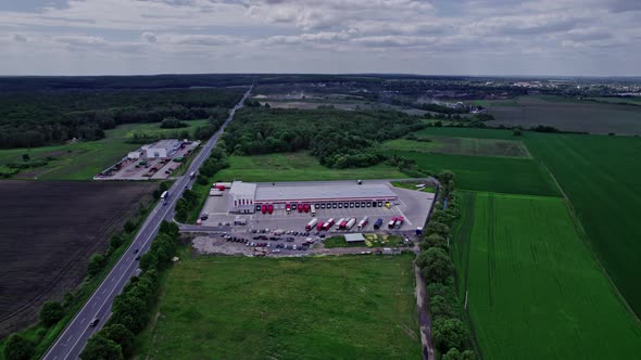 Aerial Top View of a of Semitrailer Truck Traveling Through the Parking alt