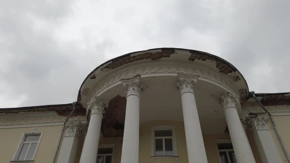 Old Building with Columns with Signs of Destruction Bottom View