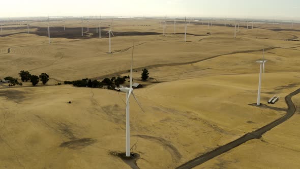 Aerial shot of Windmills in a lush green field on Montezuma Hills alt