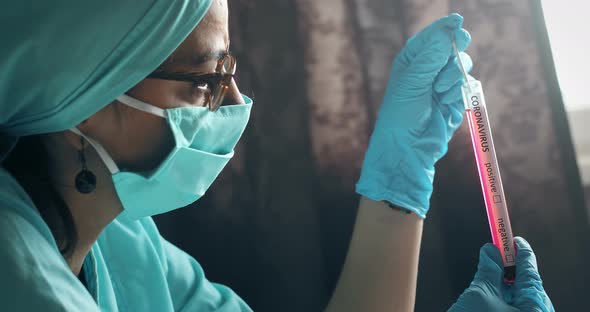 Doctor holding a coronavirus COVID-19 test tube