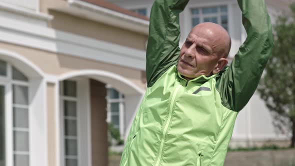 Senior Man Doing Upper Body Stretching alt