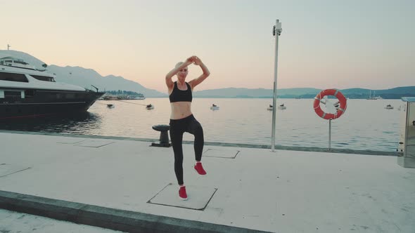 Pretty Girl Enjoying Fitness Early in the Morning in the Sea Port