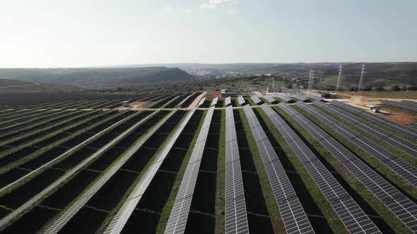Aerial pullback from photovoltaic solar panels, countryside Portugal, Renewable energy