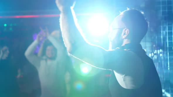 DJ is Playing Music and Waving Hands alt