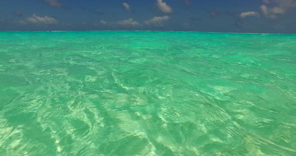 Wide Aerial Tourism Shot of A Paradise Sunny White Sand Beach and Blue Sea Background in Vibrant alt