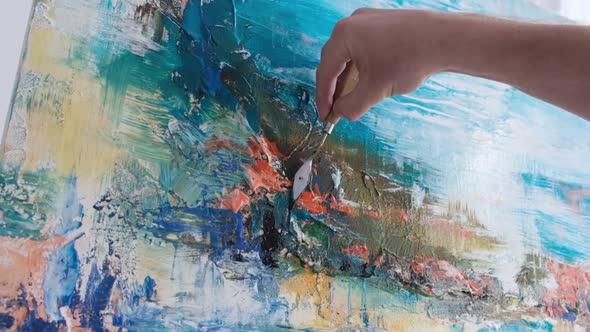 Close Up of an Artist Painting a Picture He Works in His Art Studio alt