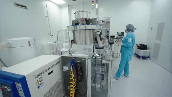 Pharmaceutical Employee Control the Automated Machinery Work alt