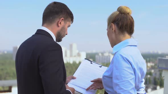 Male and Female Lawyers Discussing Contract Details Outdoor, Office Work, Career