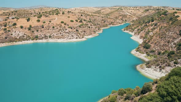 Drone View of Reservoir Dam on Blue Lake River in Countryside Cyprus Rural Desert Area