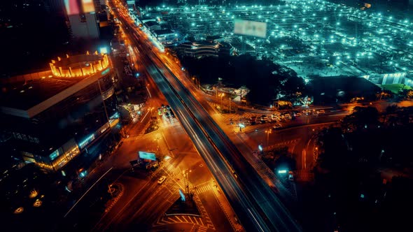 Time Lapse of Busy Highway Road Junction in Metropolis City Center at Night alt
